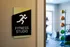 Inviting fitness studio with motivational signage, state-of-the-art equipment, and a bright, airy atmosphere.