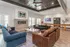 Chic communal lounge with cozy seating, stylish decor, and modern fireplace, ideal for relaxation and social gatherings.