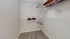 Spacious walk-in closet with sleek wire shelving and neatly organized hangers, perfect for ample storage.