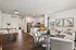 Bright and modern open-concept living space with elegant kitchen, cozy seating area, and chic decor.