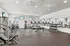 Modern fitness center with state-of-the-art exercise equipment, treadmills, and mirrored walls for an invigorating workout experience.
