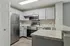 Sleek modern kitchen with stainless steel appliances, elegant gray cabinetry, and stylish marble countertops.
