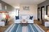 Inviting College Park Apartments living room with modern decor, cozy seating, and stylish accents.