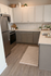 Charming kitchen with stainless steel appliances, elegant cabinetry, and a cozy ambiance, perfect for culinary enthusiasts.