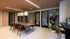 Modern dining area with a sleek wooden table, elegant pendant lights, and stylish chairs, perfect for entertaining in a luxurious apartment setting.
