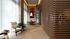 Elegant modern interior with wooden accents, featuring a cozy seating area, stylish dining table, and ambient lighting.