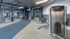Modern fitness center featuring high-end exercise machines, sleek design, and vibrant interior for an invigorating workout experience.