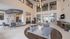 Elegant lobby of The Uptown featuring modern seating, vibrant lighting, and a welcoming reception area.