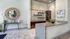 Chic and modern kitchen with sleek granite countertops, elegant dark wood cabinets, and sophisticated decor accents.