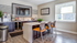 Contemporary apartment lounge with sleek island seating, modern appliances, and stylish decor, perfect for entertaining.