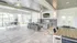 Bright and airy lounge with modern furnishing, large windows, and a view of tropical palm trees, perfect for relaxation.