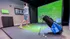 Luxurious indoor golf simulator room featuring a golfer in mid-swing, surrounded by modern decor and high-tech equipment, perfect for entertainment and relaxation.