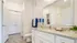 Bright and modern bathroom featuring sleek granite countertops, elegant cabinetry, and stylish accents for a luxurious feel.