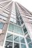 Modern high-rise building with expansive glass windows offering stunning city views.