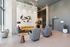 Elegant lobby with modern art, plush seating, and stylish lighting, offering a welcoming ambiance.