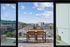 Spectacular cityscape view from a modern balcony with chic outdoor dining setup, perfect for enjoying sunsets over the skyline.