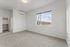Bright and spacious bedroom with large window offering scenic views, modern air conditioning, and a convenient walk-in closet.