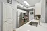 Modern kitchen with sleek stainless steel appliances, polished countertops, and ample cabinet space.