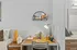 Inviting apartment home office nook with a modern desk, stylish chair, elegant decor, and warm lighting, creating a perfect work-from-home environment.