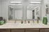Chic modern bathroom with dual sinks, framed mirrors, and stylish decor.