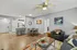 Contemporary living room with open-concept kitchen, stylish dining area, and vibrant decor.