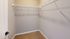 Spacious walk-in closet with ample shelving and modern design.