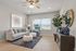 The pleasant living room creates a warm and comfortable atmosphere perfect for daily relaxation. | Legacy at Crowley |