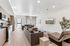 Modern open-concept living space featuring a sleek kitchen, elegant dining area, and cozy living room with stylish furnishings.