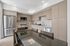 Modern kitchen with sleek cabinetry, stainless steel appliances, and a glossy dining table.