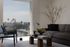 Beautiful living room with panoramic city views, elegant furniture, and natural light.