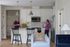 Residents enjoying coffee in white kitchen