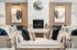 Elegant living space showcasing a modern marble fireplace, cozy seating with plush pillows, and chic abstract artwork. Perfect for relaxation and style.