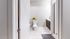 Bright and modern bathroom with sleek tiles, contemporary vanity, and cheerful sunflowers adding a touch of nature.