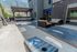 Inviting rooftop patio with elegant seating, pergola shade, and scenic mountain views for a relaxing outdoor experience.