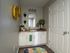 Charming bathroom with modern vanity, vibrant decor, and stylish mirror enhancing the bright ambiance.