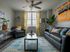 Cozy modern living room with stylish decor, vibrant yellow curtains, and a welcoming atmosphere.