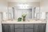 Elegant and modern bathroom with double sinks, fresh flowers, and contemporary decor.