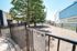Charming dog park with shady trees and comfortable seating, providing a tranquil oasis for pets and owners in a vibrant residential community.
