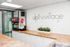 Sleek and modern beverage station at Alpine Village featuring a stylish counter and Coca-Cola fountain machine.