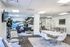 Modern communal space featuring chic seating, a sleek dining area, and an eye-catching mountain mural creating a stylish and inviting atmosphere.
