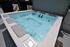 Luxurious rooftop hot tub with bubbling jets, surrounded by sleek modern design and beautiful outdoor views.