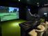Luxurious indoor golf simulator room with elegant seating and advanced virtual golf screen for immersive play.