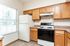 Charming kitchen with elegant wooden cabinets, modern appliances, and abundant natural light.