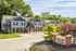 Charming apartment complex nestled in lush greenery, showcasing spacious two-story units at Water's Edge of Delaware.