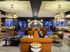 Luxurious modern lounge with elegant lighting, plush seating, and a stylish bar area for ultimate relaxation and social gatherings.