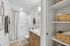 Guest bathroom with modern finishes and convenient built-in linen storage