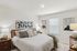 Spacious primary suite with plenty of room for a king-size bed and more