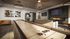 Stylish recreation lounge featuring a shuffleboard table, cozy leather seating, arcade machine, and a modern fireplace for a luxurious entertainment experience.