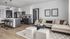 Chic modern living space featuring an open floor plan with sleek kitchen, stylish bar seating, and cozy lounge area with elegant decor.