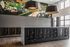 Modern apartment lobby featuring secure mailbox area with vibrant wall art and elegant lighting fixtures.
